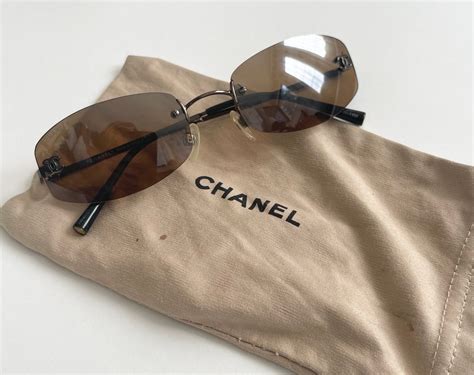 chanel sunglasses round logo|chanel rimless sunglasses.